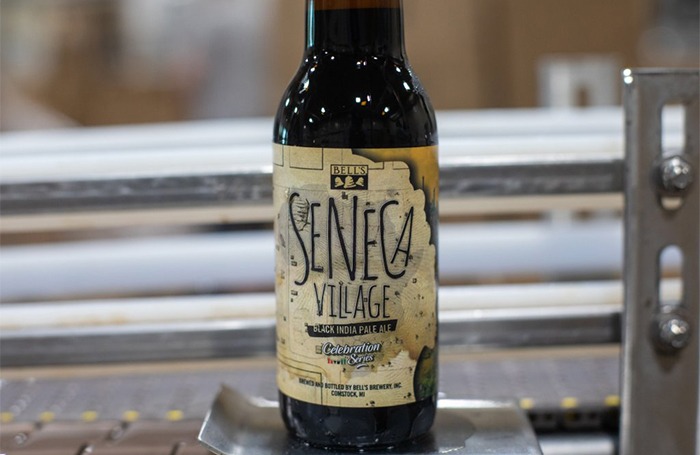 A bottle of Seneca Village on the Bottling Line just after being packaged.