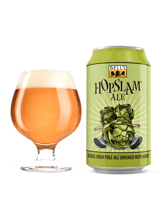 A full snifter glass sitting next to Hopslam Ale