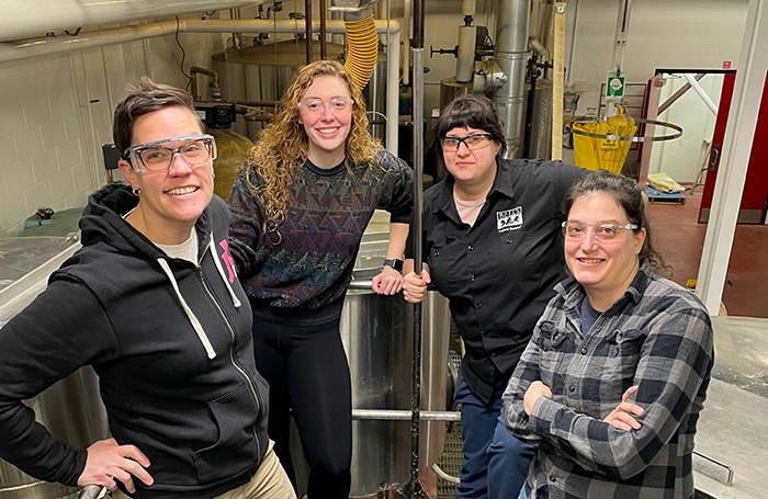 Members of the Pink Boots Society stand in Bell's downtown Kalamazoo Brewery